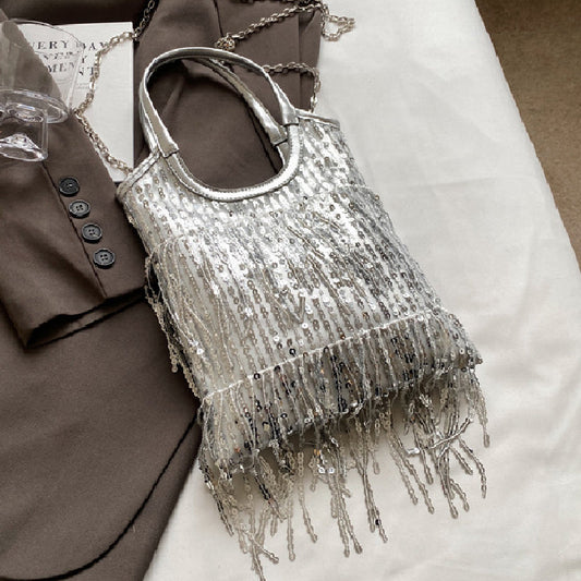 Bolsos informales de retazos con borlas y lentejuelas