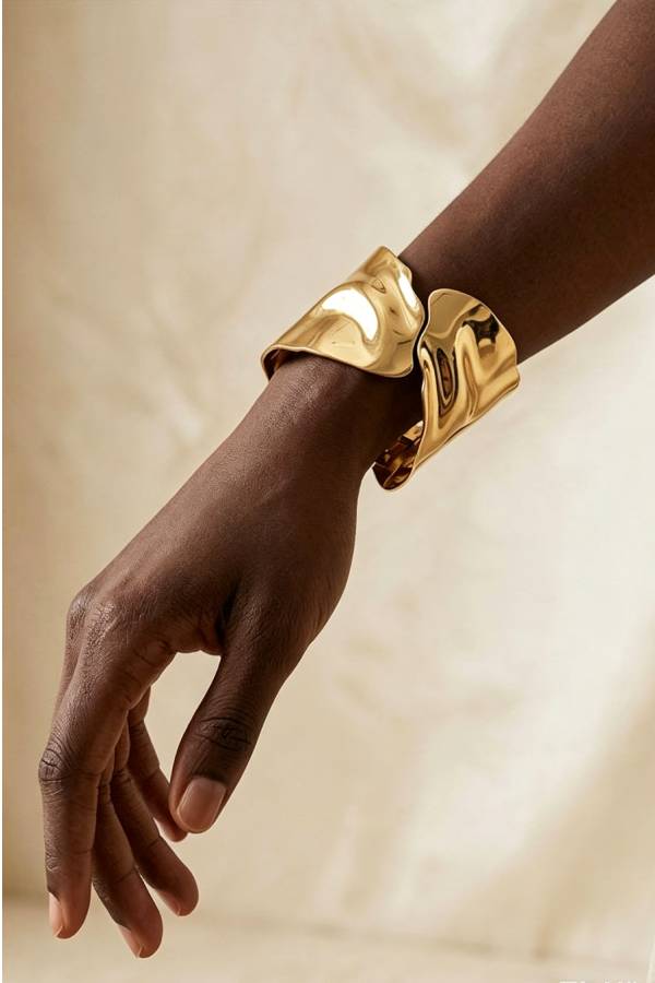 A Stylish and Distinctive Open-style Bracelet Featuring An Irregular, Crisscross Design.