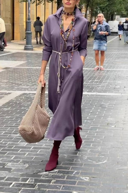 Satin shirt dress with a fitted waist and side slit.
