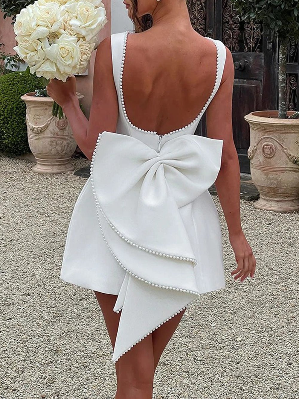 Sleeveless Pearl Trim Bow Back Cascading Ruffle A-Line Mini Dress