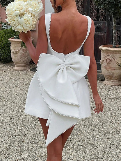 Sleeveless Pearl Trim Bow Back Cascading Ruffle A-Line Mini Dress