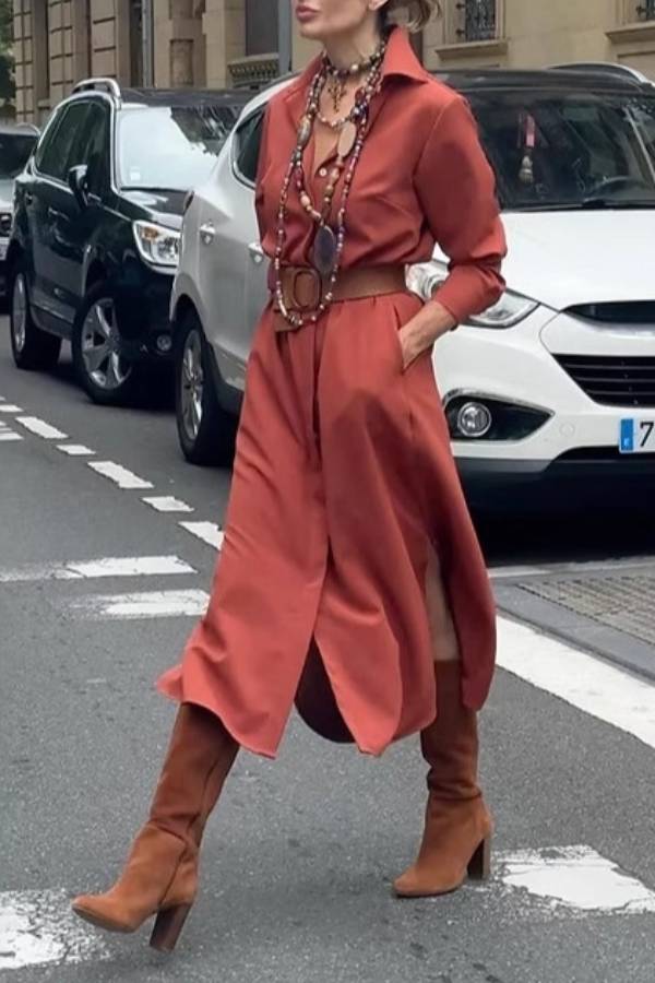 Satin shirt dress with a fitted waist and side slit.